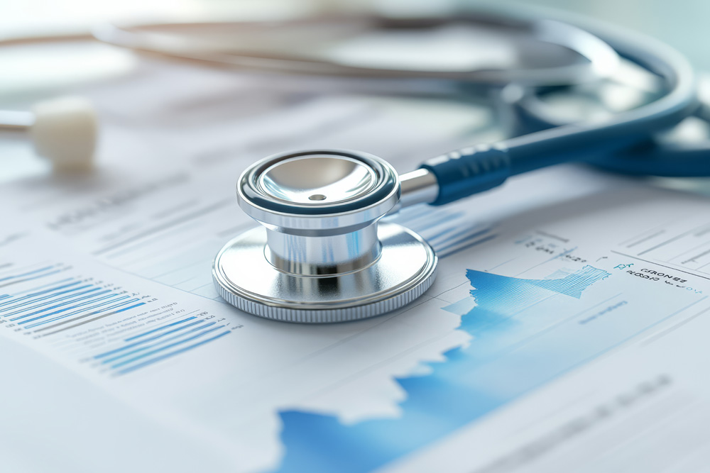 stethoscope rests on financial report